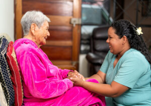 time for in-home care, caregiver and older adult woman