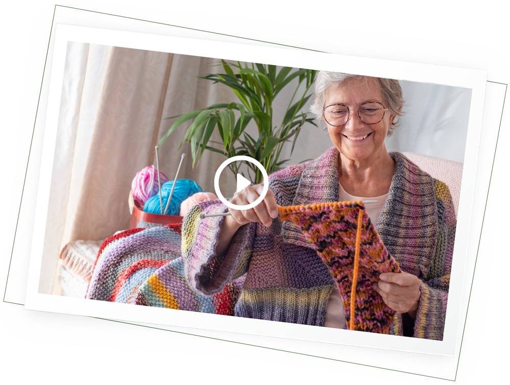 senior woman knitting happily